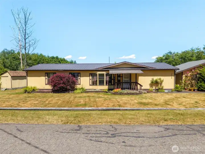 3 bedroom manufactured home with metal roof on a quiet road in Hansville