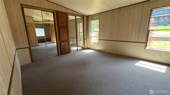 Primary bedroom with built-ins and closet