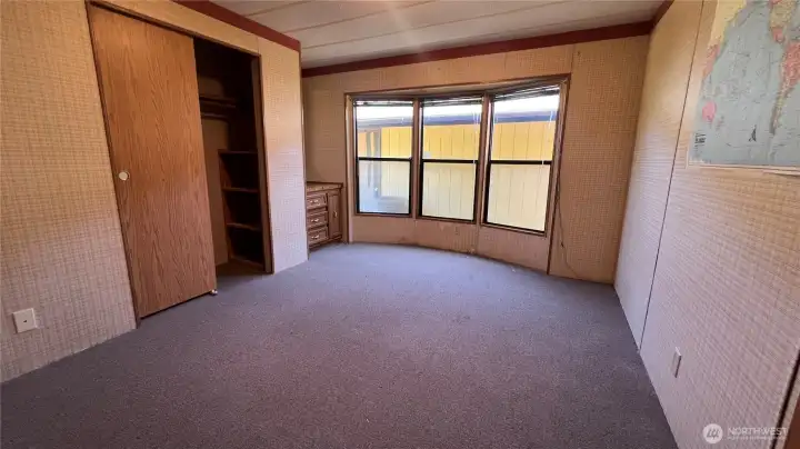Another bedroom with closet and built-in