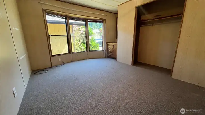 Third bedroom with closet and built-in cabinetry