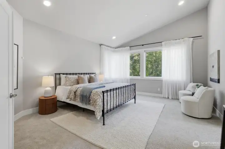 A spacious primary with vaulted ceilings. A spacious primary with vaulted ceilings.