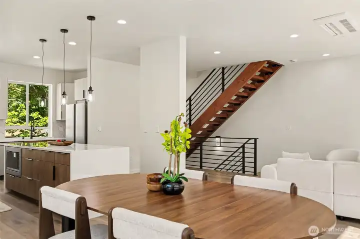Great open-concept main living area filled with natural light complete with wood stairs and other beautiful designer finishes. Great open-concept main living area filled with natural light complete with wood stairs and other beautiful designer finishes.