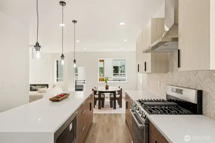 Kitchens is complete with huge island, stainless steel appliances included built in microwave, quartz countertops, stone backsplashes, full range hood, high quality fixtures. Kitchens is complete with huge island, stainless steel appliances included built in microwave, quartz countertops, stone backsplashes, full range hood, high quality fixtures.
