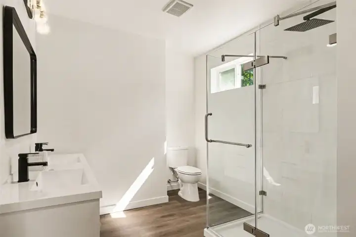 Primary Bathroom complete with double vanity and large walk-in shower. Natural light thru large window. Primary Bathroom complete with double vanity and large walk-in shower. Natural light thru large window.