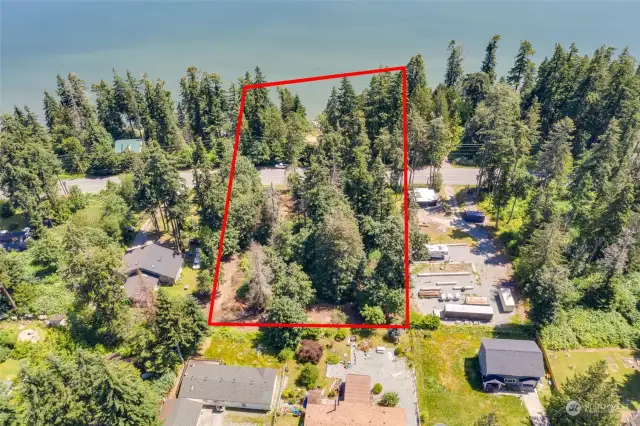 An aerial view of entire porperty from top west side of property looking east toward the sound.