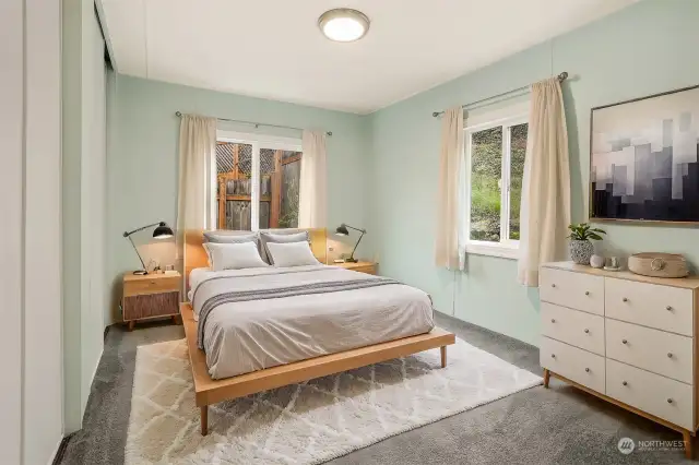 Master bedroom suite with dual closets and a remodeled bathroom.  Virtually staged photo.