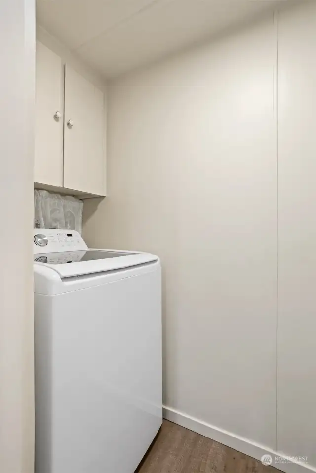 Utility room with full size washer and dryer included.