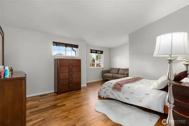 Primary suite features sitting area.