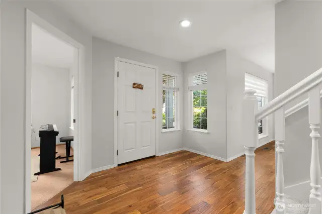 Entry with gleaming hardwoods.