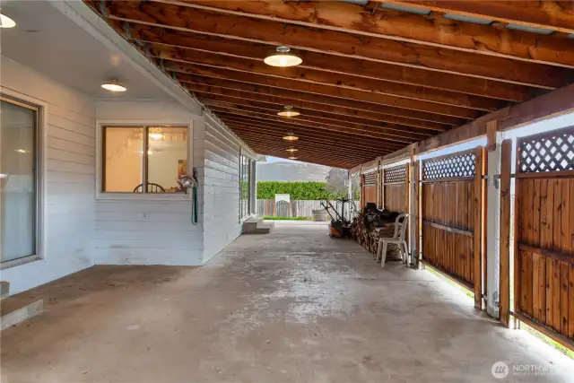 Huge Covered Patio Runs Length of West Side of Home
