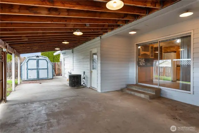 Huge Covered Patio Runs Length of West Side of Home