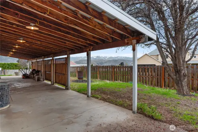 Huge Covered Patio Runs Length of West Side of Home