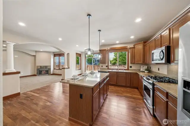 This gorgeous Kitchen features so many craftsman details from extra trim work to the columns....