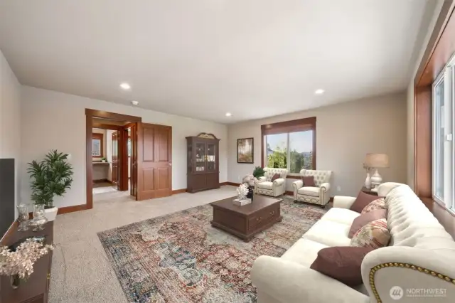 The Bonus Room features 2 large windows, and overlooks the backyard. (Virtually staged).