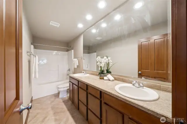 The Main Bath is spacious w/great storage.