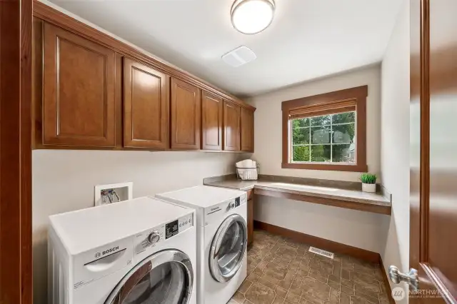 The spacious Laundry is located upstairs and features great storage and plenty of space to fold. The new Bosch W&D are included with the Home.