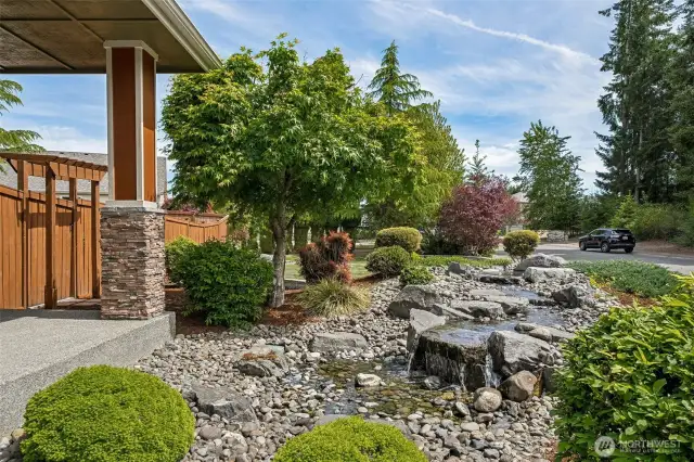 This custom waterfall adds to the ambience of this beautiful Home.