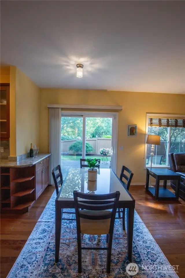 The designer cabinets wrap around to the casual eating area to provide this unique beverage center.