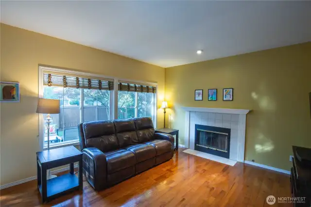 The family room is located off the kitchen and casual eating area, with those beautiful hardwood floors and gas fireplace.  This room looks out to the large patio and fenced back yard.