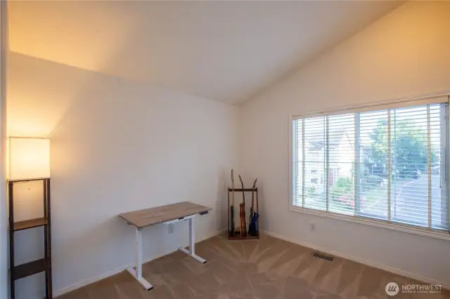 Bedroom #3 also has vaulted ceilings and is currently used as a hobby and music room.  Bedrooms 2 - 4 are all located in the other part of the upstairs level with the main full bathroom just steps away for convenience.