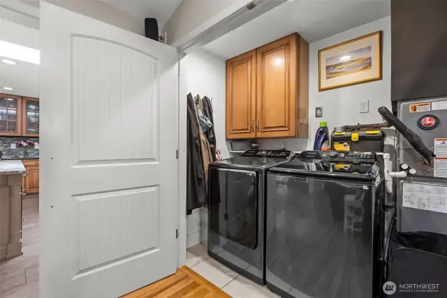 Utility closet with new washer and dryer. Both appliances stay