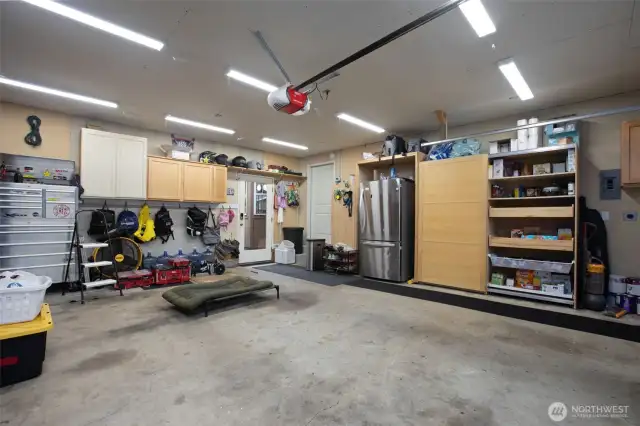 Garage with plenty of storage and brand new garage door