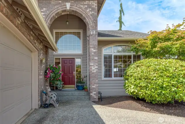 The stately entrance has lots of room for your summer pots!