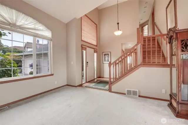 You will note all of the natural lighting in this entry, beautiful staircase and the meticulous hardwood floors.
