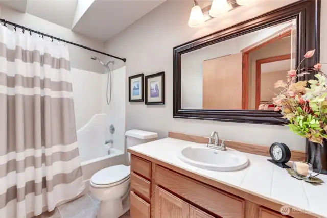 Main bathroom on second floor boasts skylight and beauty.