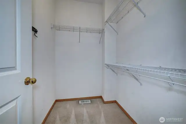 Primary bedroom walk-in closet