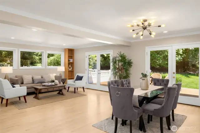 Great room & dining area with patio doors that open to backyard
