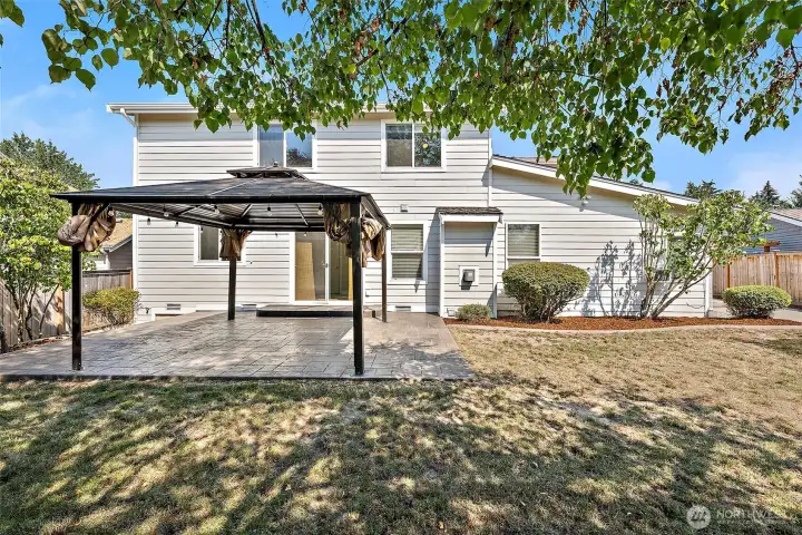 Enjoy summer evenings, BBQs, and year round gatherings in this backyard!