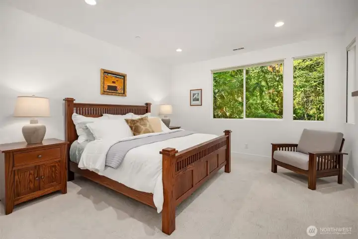 Primary bedroom suite with views over back garden