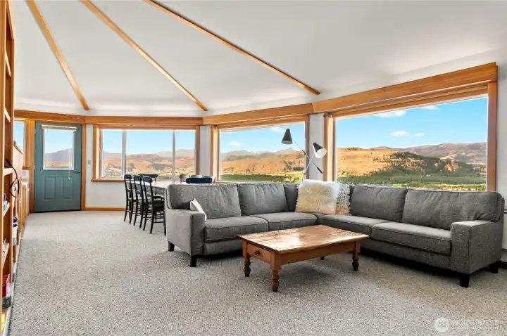Light-filled living room with windows on every side captures endless scenery.
