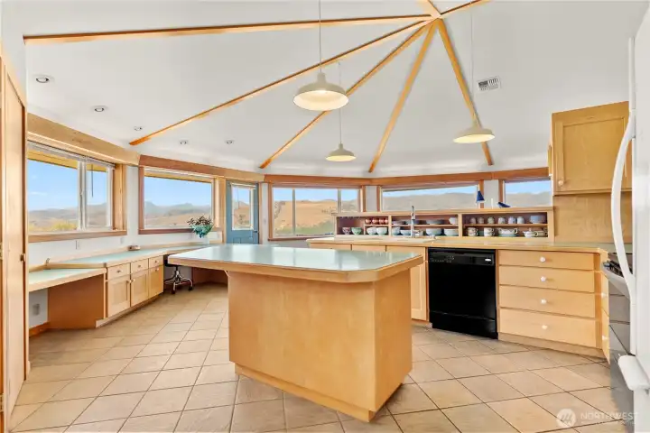 Vaulted ceilings add drama and volume to the main living areas. Outdoor patio just beyond the door, ideal for eating under the stars.