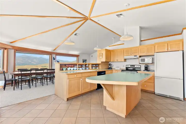 Open concept design unites living, dining, and kitchen—ideal for gatherings.