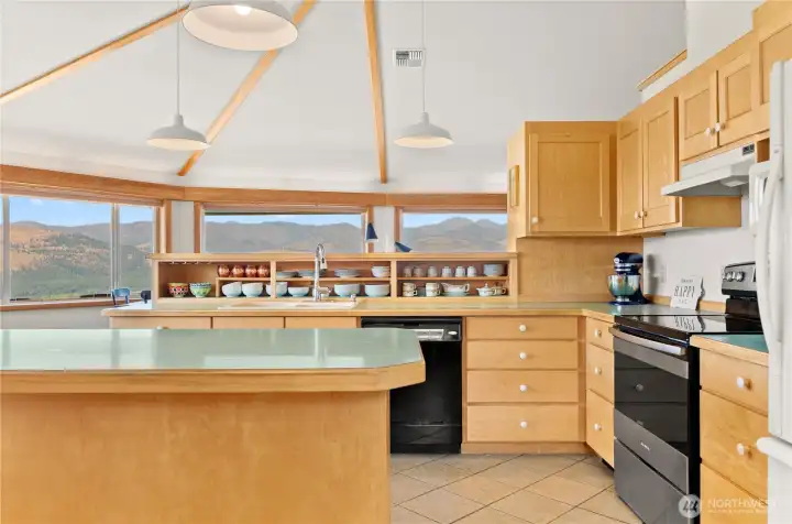 Kitchen windows showcase sweeping mountain panoramas while you cook.