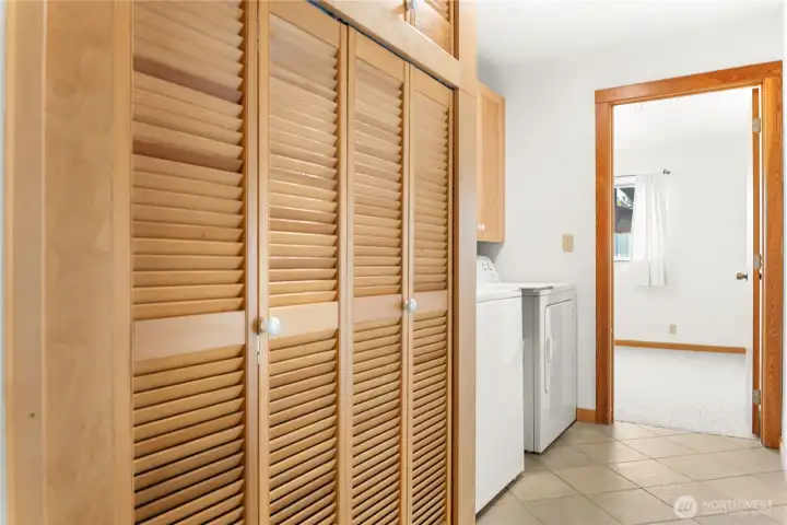 Bright utility room with washer, dryer, and built-in storage—designed for convenience and everyday ease.