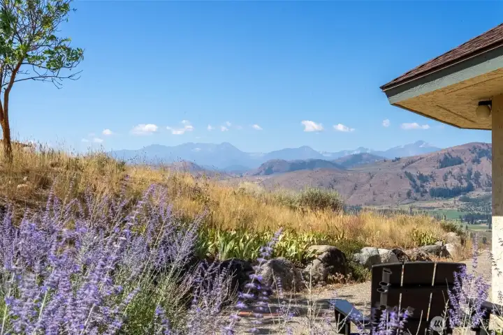 Concrete patios extend outdoor living while showcasing dramatic vistas.