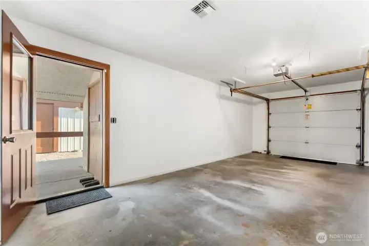 Detached carport and single-car garage provide ample covered parking.