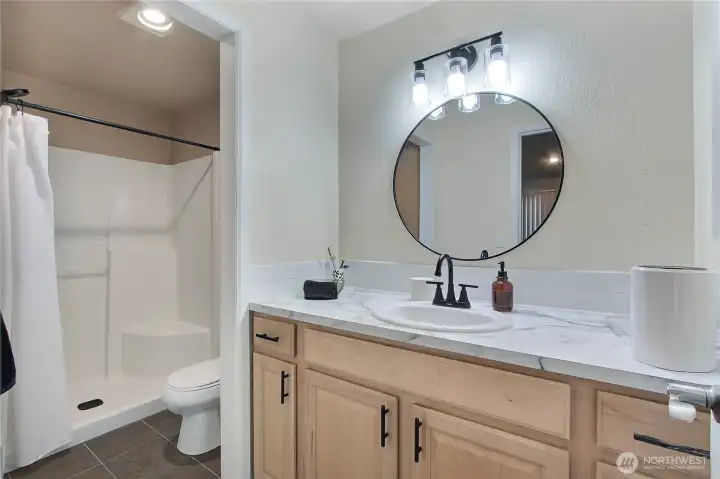 Primary Bath with new countertops and updated fixtures.