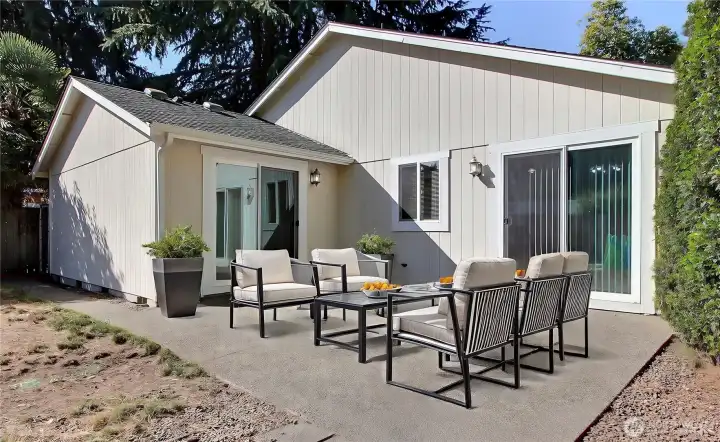 Patio is virtually staged. Great for entertaining. Accessed from dining area and the Primary bedroom.