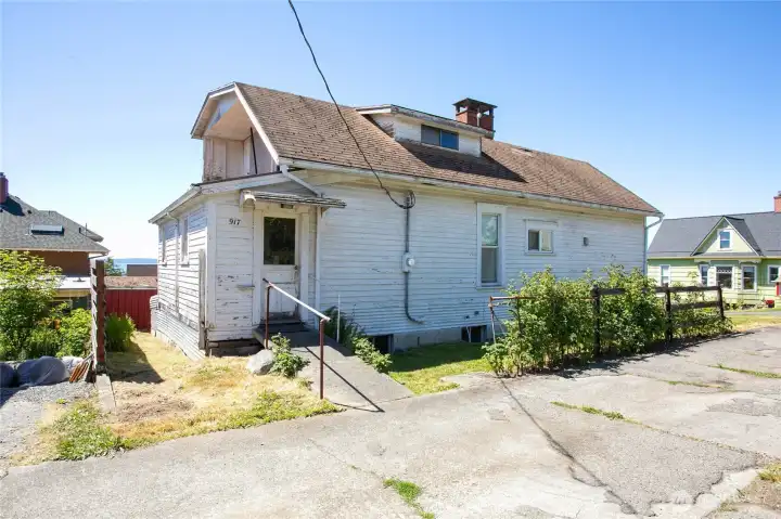 Back entry from the alley leads to an enclosed porch.
