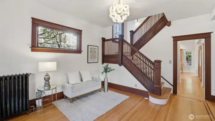 Spacious entry with original woodwork, high ceilings, lots of light.