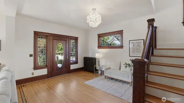 Spacious entry with original woodwork, high ceilings, lots of light.