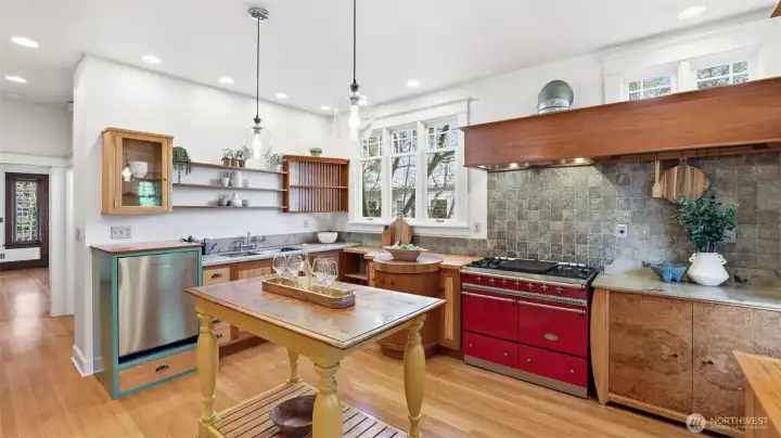 Custom French-country style kitchen with Lacanche range, Thermador hood vent, Sub-Zero Fridge, limestone counters & lots of storage