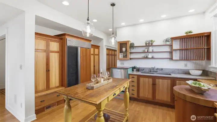 Custom French-country style kitchen with Lacanche range, Thermador hood vent, Sub-Zero Fridge, limestone counters & lots of storage