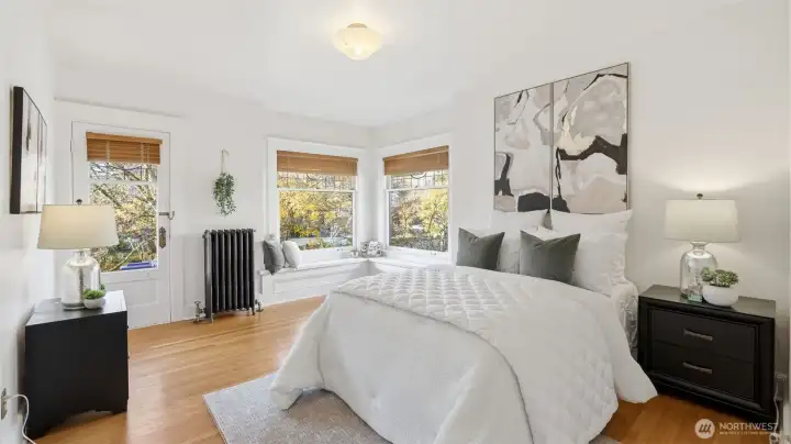 2 of 4 upstairs bedrooms also has a built-in window seat and deck access.