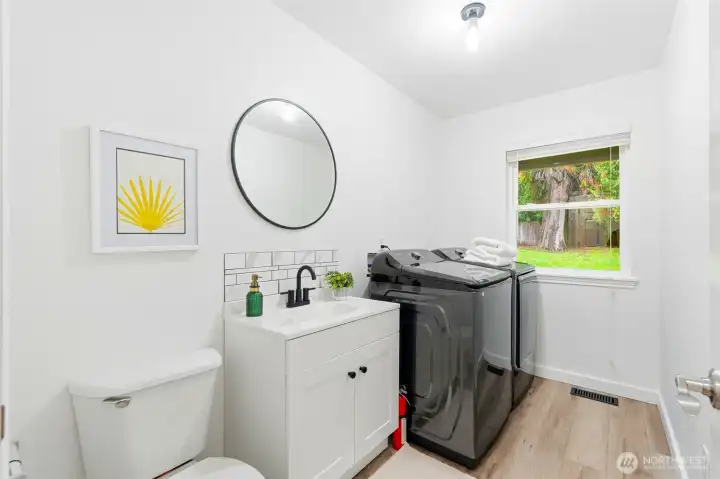 Lower level 1/2 bath + laundry room