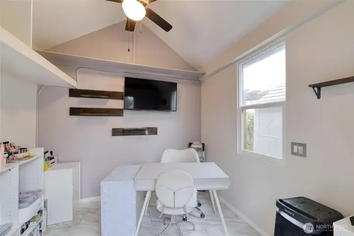 Interior of the finished outbuilding located in the backyard (Virtually Staged)